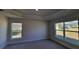 Well-lit bedroom with new carpet and neutral-colored walls at 7658 Sw 102Nd Loop, Ocala, FL 34476