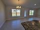 Bright living room with tile floors and a view of the backyard at 7658 Sw 102Nd Loop, Ocala, FL 34476