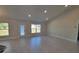 Spacious living area with tile floors and access to a backyard patio at 7658 Sw 102Nd Loop, Ocala, FL 34476