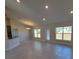 Bright and spacious living room with tile flooring and access to a patio at 7658 Sw 102Nd Loop, Ocala, FL 34476