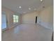 Open living room with tile floors and plenty of natural light at 7658 Sw 102Nd Loop, Ocala, FL 34476