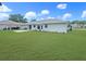Spacious backyard featuring a large grassy area and a partial fence at 4937 Nw 30Th Pl, Ocala, FL 34482