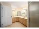 Bathroom featuring a dual sink vanity, tile flooring, and a large mirror at 4937 Nw 30Th Pl, Ocala, FL 34482