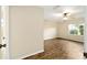 Bedroom featuring laminate flooring, a ceiling fan, and a large window providing natural light at 4937 Nw 30Th Pl, Ocala, FL 34482