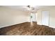 Bedroom featuring laminate flooring, a ceiling fan, and a double door closet for ample storage at 4937 Nw 30Th Pl, Ocala, FL 34482