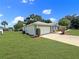 Charming single-story home featuring a well-manicured lawn and a spacious two-car garage at 4937 Nw 30Th Pl, Ocala, FL 34482