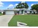 Charming single-story home featuring a well-manicured lawn and a classic architectural design at 4937 Nw 30Th Pl, Ocala, FL 34482