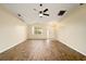 This expansive living room boasts stylish flooring, a ceiling fan, and abundant space for relaxation and entertainment at 4937 Nw 30Th Pl, Ocala, FL 34482