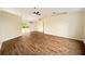 Expansive living room featuring modern flooring, an open layout, and sliding glass doors to the backyard at 4937 Nw 30Th Pl, Ocala, FL 34482