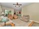 Bright living room with tile flooring and comfortable seating at 6925 Se 96Th Place Rd, Belleview, FL 34420