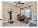 Comfortable office with tile floors, a ceiling fan, and a large window for natural light at 6925 Se 96Th Place Rd, Belleview, FL 34420