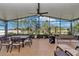 The screened patio provides ample space for dining, lounging, and enjoying the outdoors at 6925 Se 96Th Place Rd, Belleview, FL 34420