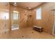 Accessible bathroom with tile shower, grab bars, and a built-in bench for comfortable bathing at 17800 Se 237Th Ct, Umatilla, FL 32784