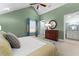 Bedroom featuring vaulted ceiling, ceiling fan, and an attached bathroom at 17800 Se 237Th Ct, Umatilla, FL 32784