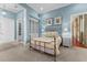 Cozy bedroom featuring a wrought iron bed frame, soft carpet, and built in shelving at 17800 Se 237Th Ct, Umatilla, FL 32784