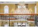 A grand crystal chandelier hangs above the foyer, adding elegance to the home's entrance at 17800 Se 237Th Ct, Umatilla, FL 32784