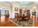 A large dining room with fireplace and large windows that provide an abundance of natural light at 17800 Se 237Th Ct, Umatilla, FL 32784