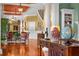 Grand foyer featuring hardwood floors, detailed columns and stairs to the upper level at 17800 Se 237Th Ct, Umatilla, FL 32784