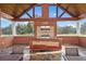 Outdoor kitchen under a covered patio, equipped with a grill and countertops for entertainment at 17800 Se 237Th Ct, Umatilla, FL 32784