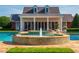 A beautiful pool view of the backyard with a fountain and seating areas, great for relaxation and enjoyment at 17800 Se 237Th Ct, Umatilla, FL 32784