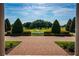 Professionally landscaped grounds with a fountain in the center of the yard at 17800 Se 237Th Ct, Umatilla, FL 32784
