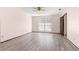 Bright bedroom with ceiling fan and wood-look floors at 21406 Sw Plantation St, Dunnellon, FL 34431