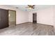 Bedroom featuring wood-look floors and ample closet space at 21406 Sw Plantation St, Dunnellon, FL 34431