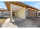 Covered entryway with stone pillars and a concrete floor at 21406 Sw Plantation St, Dunnellon, FL 34431