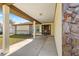 House exterior showcasing a covered walkway and stone accents at 21406 Sw Plantation St, Dunnellon, FL 34431