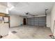 Garage with overhead door and storage space at 21406 Sw Plantation St, Dunnellon, FL 34431