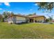 House exterior with attached garage and carport at 21406 Sw Plantation St, Dunnellon, FL 34431