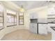 Kitchen nook with corner window and white cabinets at 21406 Sw Plantation St, Dunnellon, FL 34431