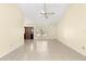 Living room featuring tiled floors and a large window at 21406 Sw Plantation St, Dunnellon, FL 34431