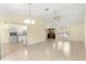 Bright living room with tile flooring and ceiling fan at 21406 Sw Plantation St, Dunnellon, FL 34431