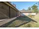 View of backyard featuring a screened patio and detached building at 4215 Se 24Th Ter, Ocala, FL 34480