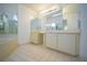 Bathroom with garden tub, modern vanity, and large mirror at 4215 Se 24Th Ter, Ocala, FL 34480