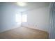 Sunlit bedroom with neutral carpet and white cabinets at 4215 Se 24Th Ter, Ocala, FL 34480