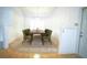 Bright dining room with a wooden table and green velvet chairs at 4215 Se 24Th Ter, Ocala, FL 34480