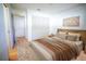 Cozy main bedroom with a plush bed, accent floral rug, a closet, and an ensuite bathroom at 4215 Se 24Th Ter, Ocala, FL 34480