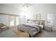 Airy main bedroom with french doors, decorative prints, a ceiling fan, and neutral decor at 4215 Se 24Th Ter, Ocala, FL 34480