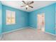 Light blue bedroom with ceiling fan and window shutters at 4737 Se 36Th St, Ocala, FL 34480