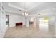 Bright dining room with built-in shelving and chandelier at 4737 Se 36Th St, Ocala, FL 34480