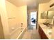 Bathroom featuring bathtub, shower, double sink, and marble countertops at 3403 Gatlin Place Cir, Orlando, FL 32812