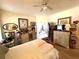 Bedroom featuring hardwood floors, bright lighting, a queen sized bed, and decor at 3403 Gatlin Place Cir, Orlando, FL 32812