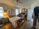 Well-lit bedroom featuring a queen sized bed, ceiling fan, and decor at 3403 Gatlin Place Cir, Orlando, FL 32812