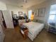 This is a comfortable bedroom with carpeted floors, a ceiling fan, and a queen bed at 3403 Gatlin Place Cir, Orlando, FL 32812