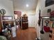 Hallway with hardwood floors, multiple doors, and country-style decor at 3403 Gatlin Place Cir, Orlando, FL 32812