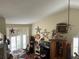 Living room featuring high ceilings, natural lighting, ceiling fan, and decor at 3403 Gatlin Place Cir, Orlando, FL 32812