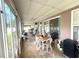 The enclosed patio has tile flooring, lots of light, and dining area at 3403 Gatlin Place Cir, Orlando, FL 32812