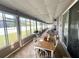 Enclosed patio with many windows providing lots of light to the dining area at 3403 Gatlin Place Cir, Orlando, FL 32812